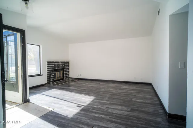 a view of kitchen with furniture and a window