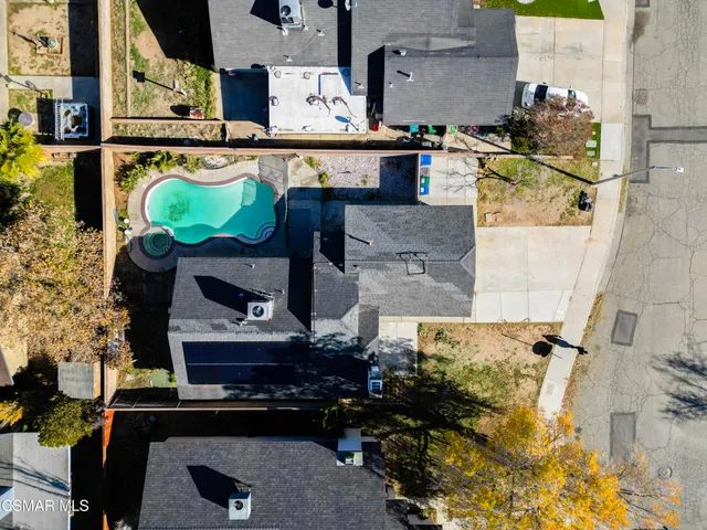 an aerial view of residential house with outdoor space