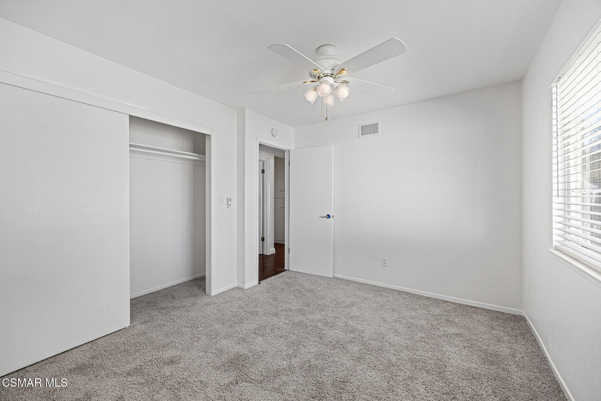 1521 Church Street Simi Valley, CA 93065 - Photo 12 of 16 wooden floor in an empty room with a window