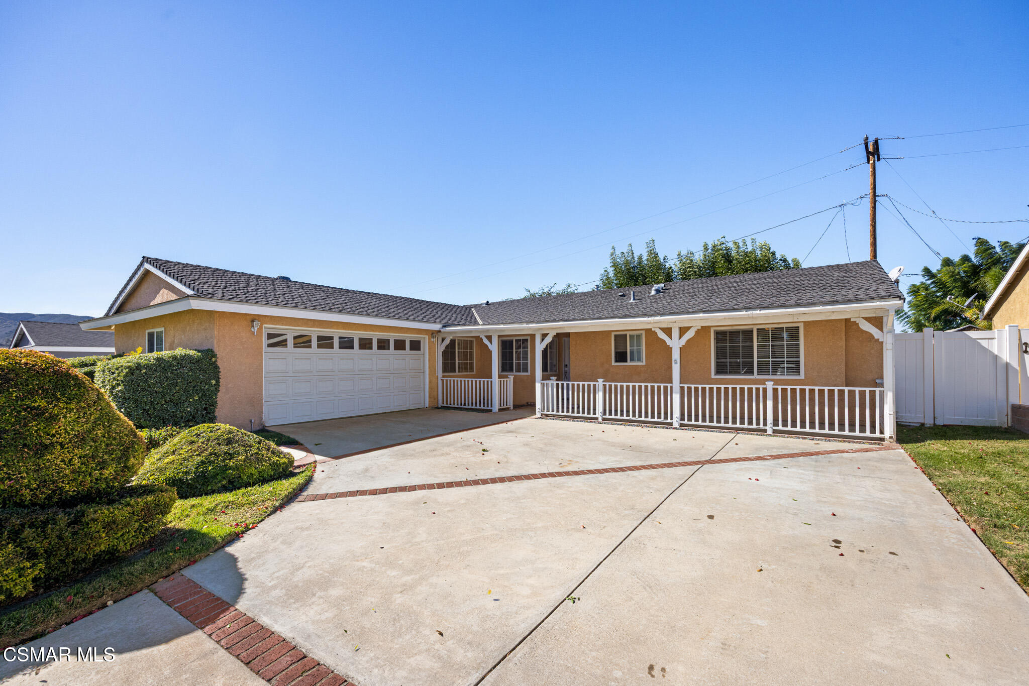 1521 Church Street Simi Valley, CA 93065 - Photo 2 of 16 a front view of a house with a yard and garage