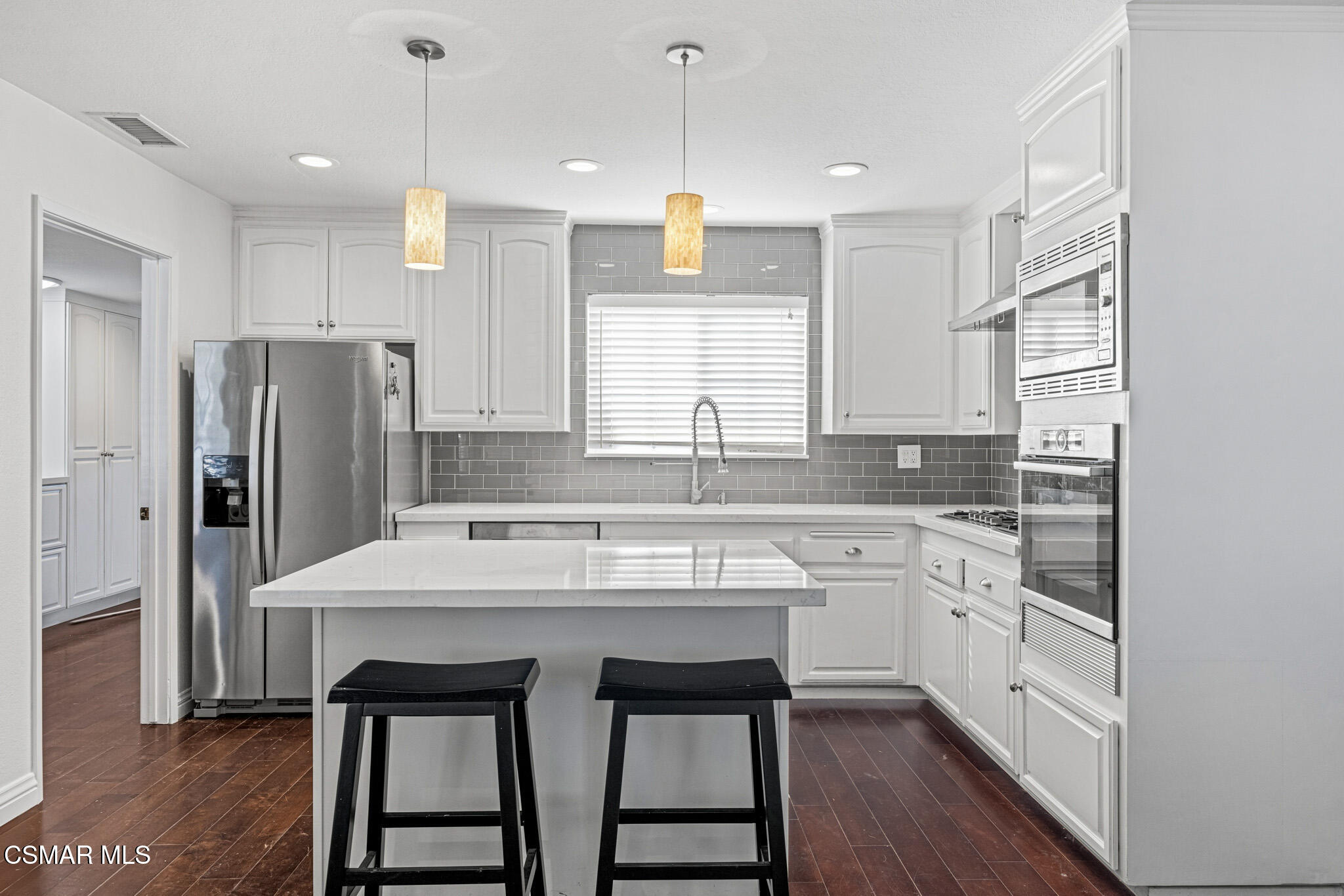 1521 Church Street Simi Valley, CA 93065 - Photo 3 of 16 a kitchen with stainless steel appliances granite countertop a sink a stove a refrigerator and island with wooden floor