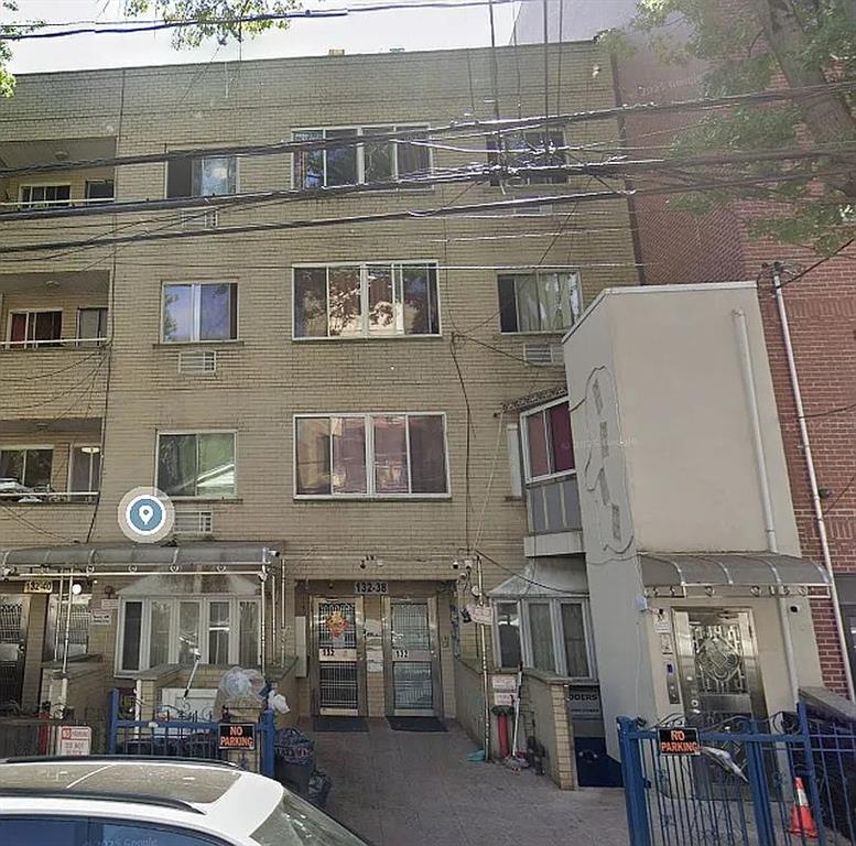 a view of a brick building with many windows