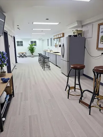 a dining room with furniture and wooden floor