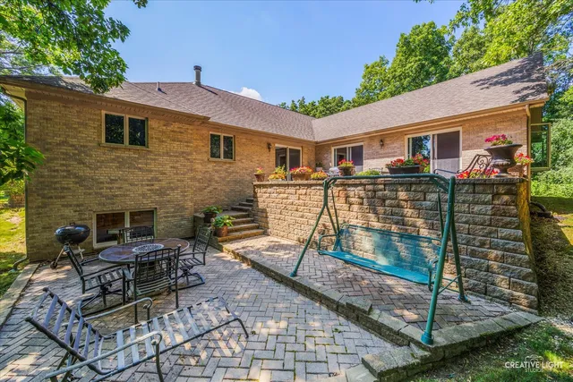 a view of house with outdoor seating space