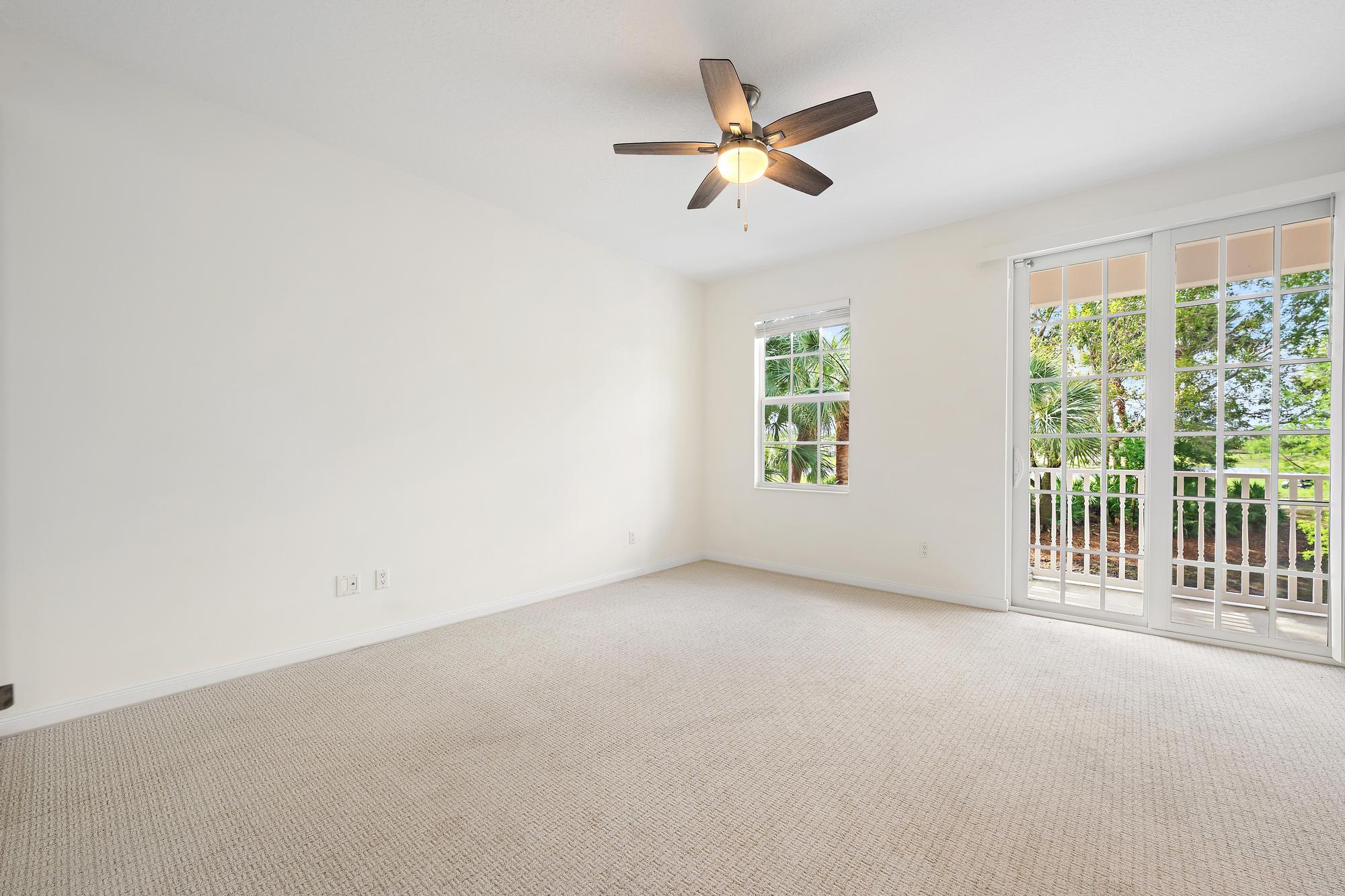136 Ashley Court Jupiter, FL 33458 - Photo 11 of 26 an empty room with windows