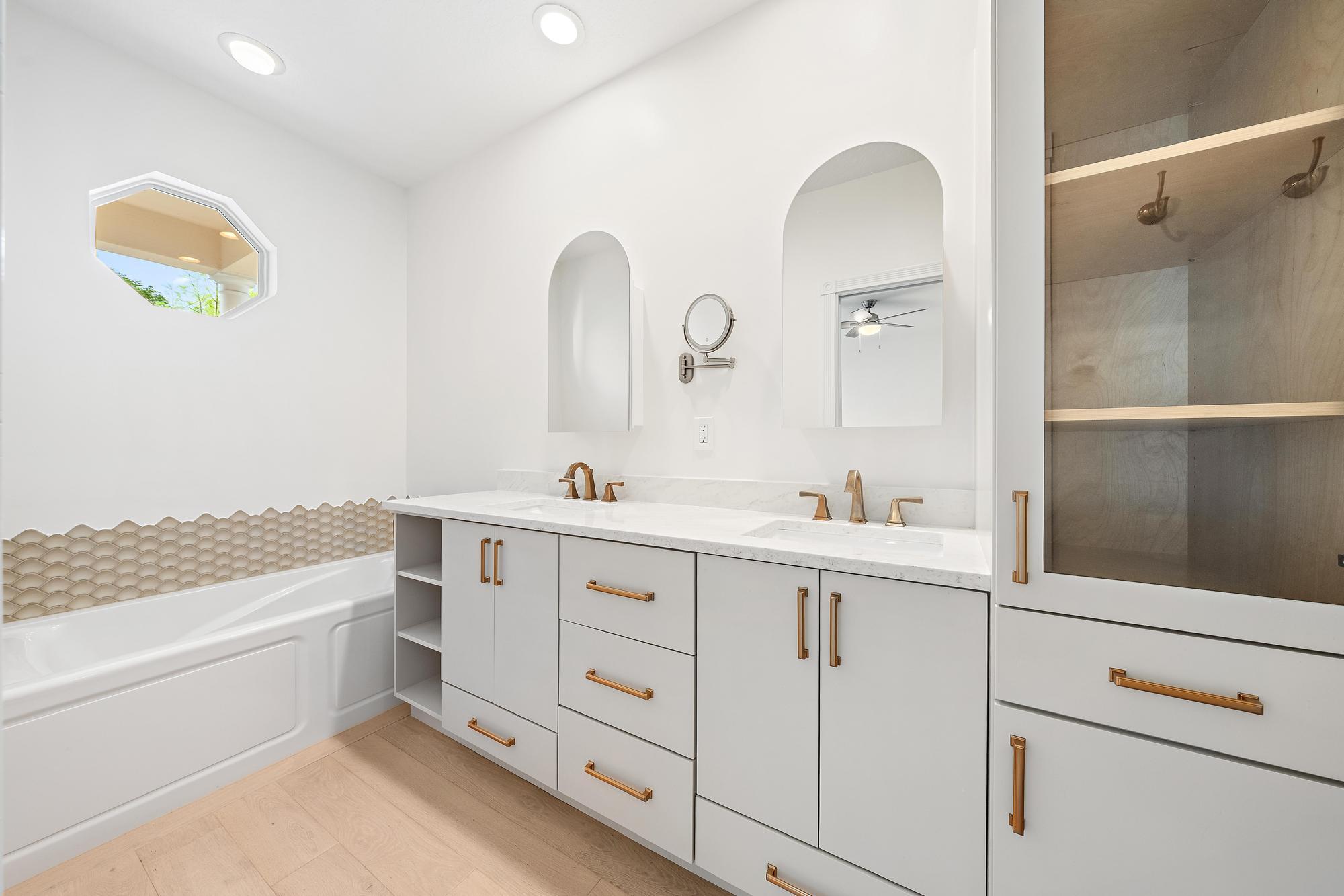 136 Ashley Court Jupiter, FL 33458 - Photo 13 of 26 a bathroom with a double vanity sink and a mirror