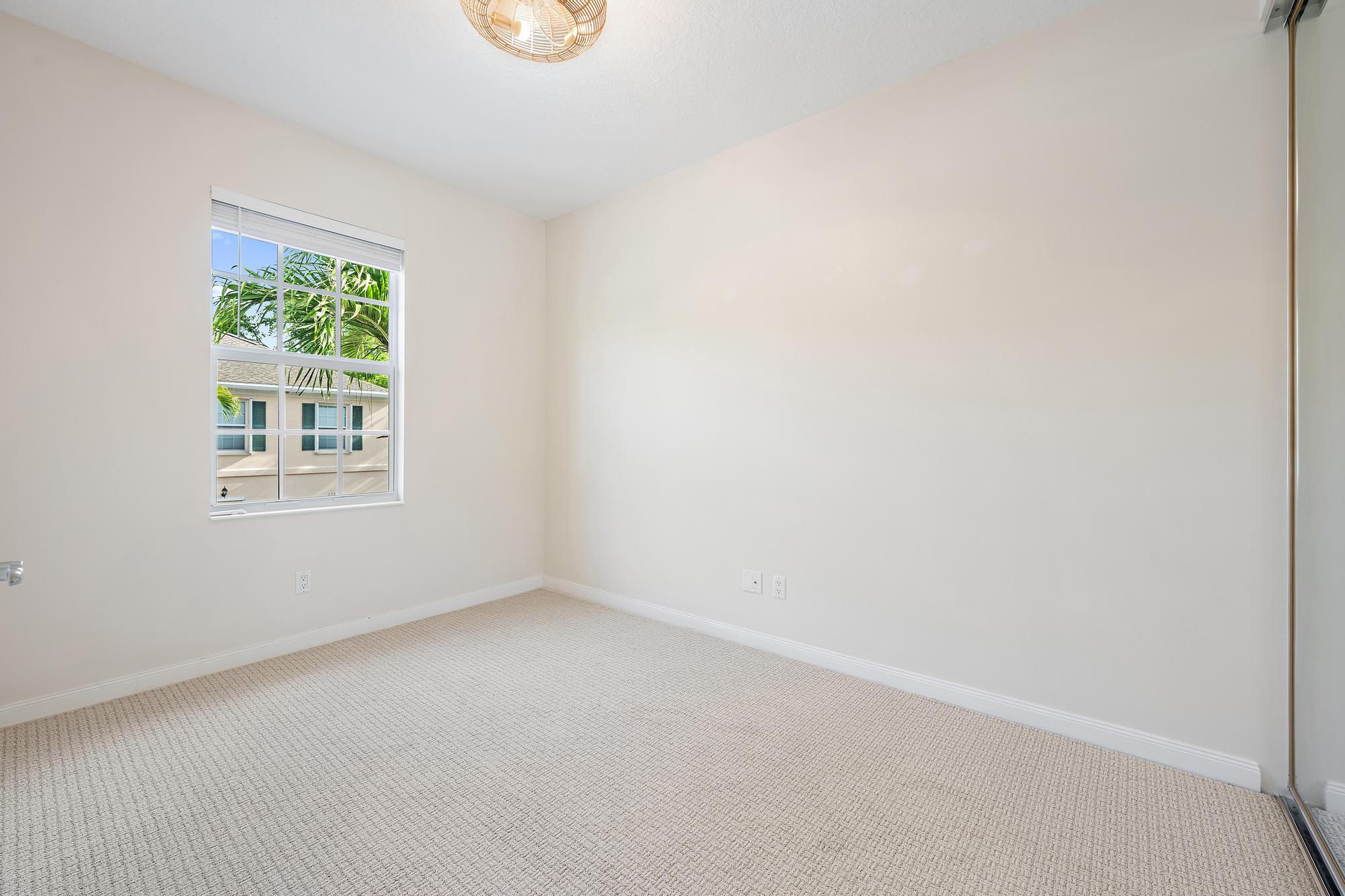 136 Ashley Court Jupiter, FL 33458 - Photo 16 of 26 an empty room with a window