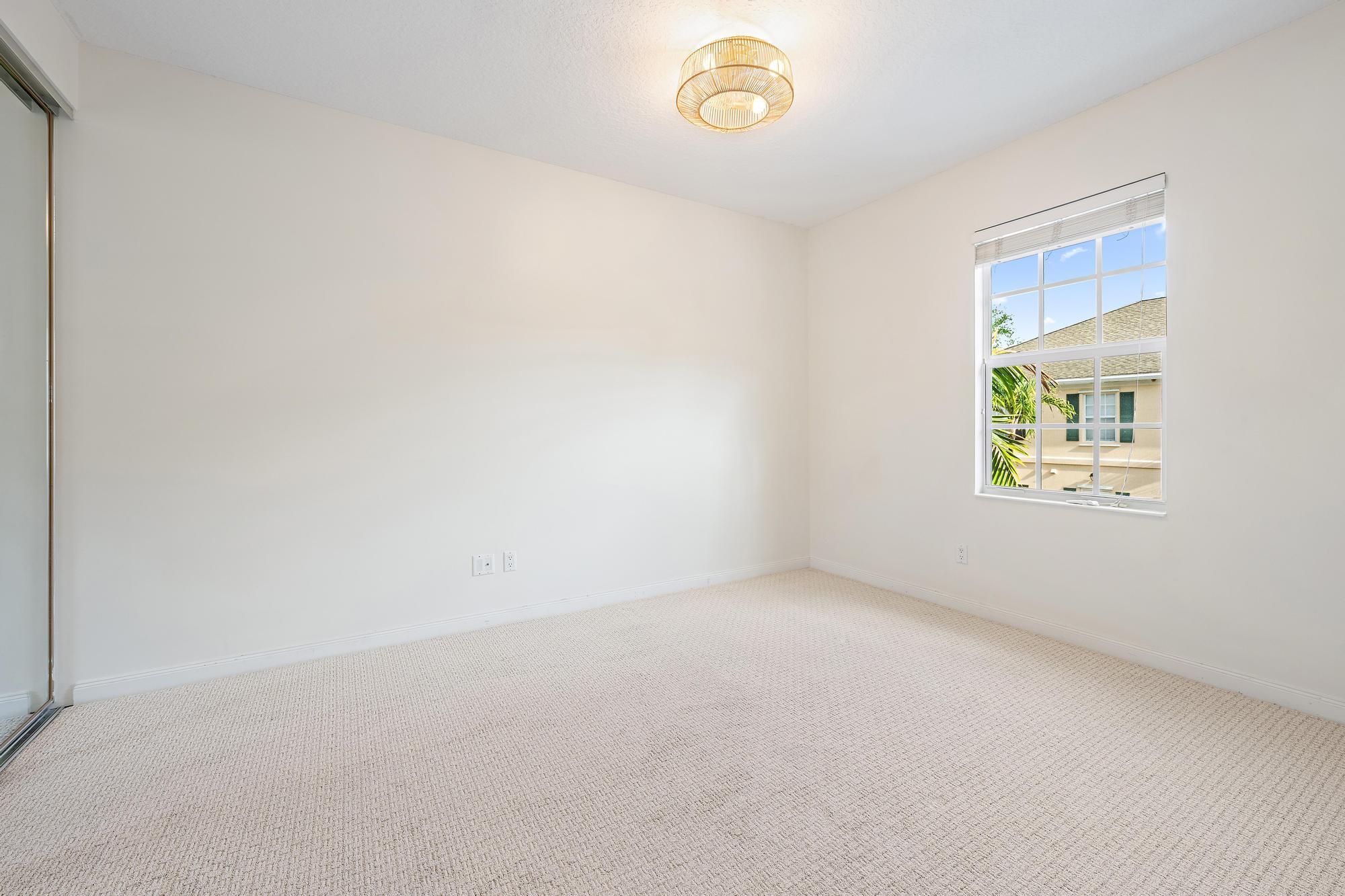 136 Ashley Court Jupiter, FL 33458 - Photo 18 of 26 an empty room with windows
