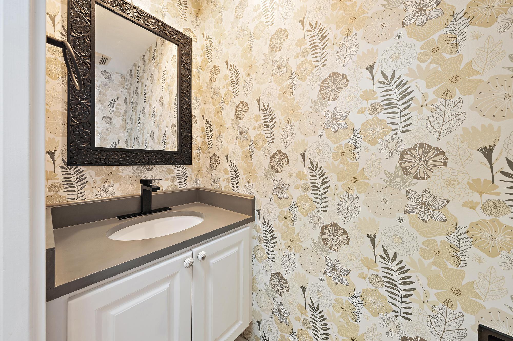 136 Ashley Court Jupiter, FL 33458 - Photo 19 of 26 a bathroom with a sink and a mirror
