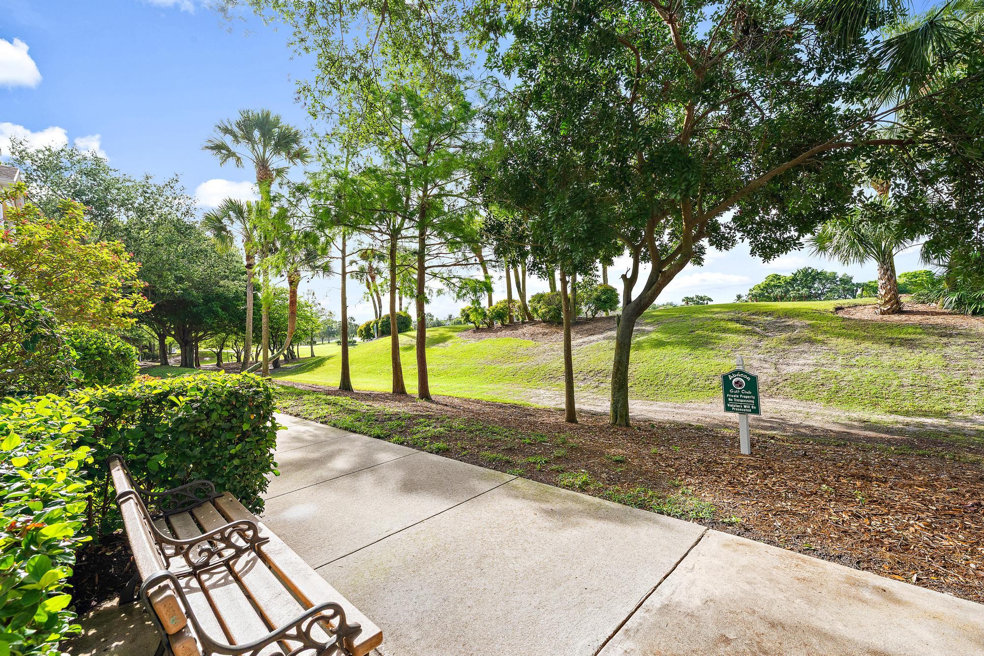 136 Ashley Court Jupiter, FL 33458 - Photo 22 of 26 a park view with a sitting space and garden
