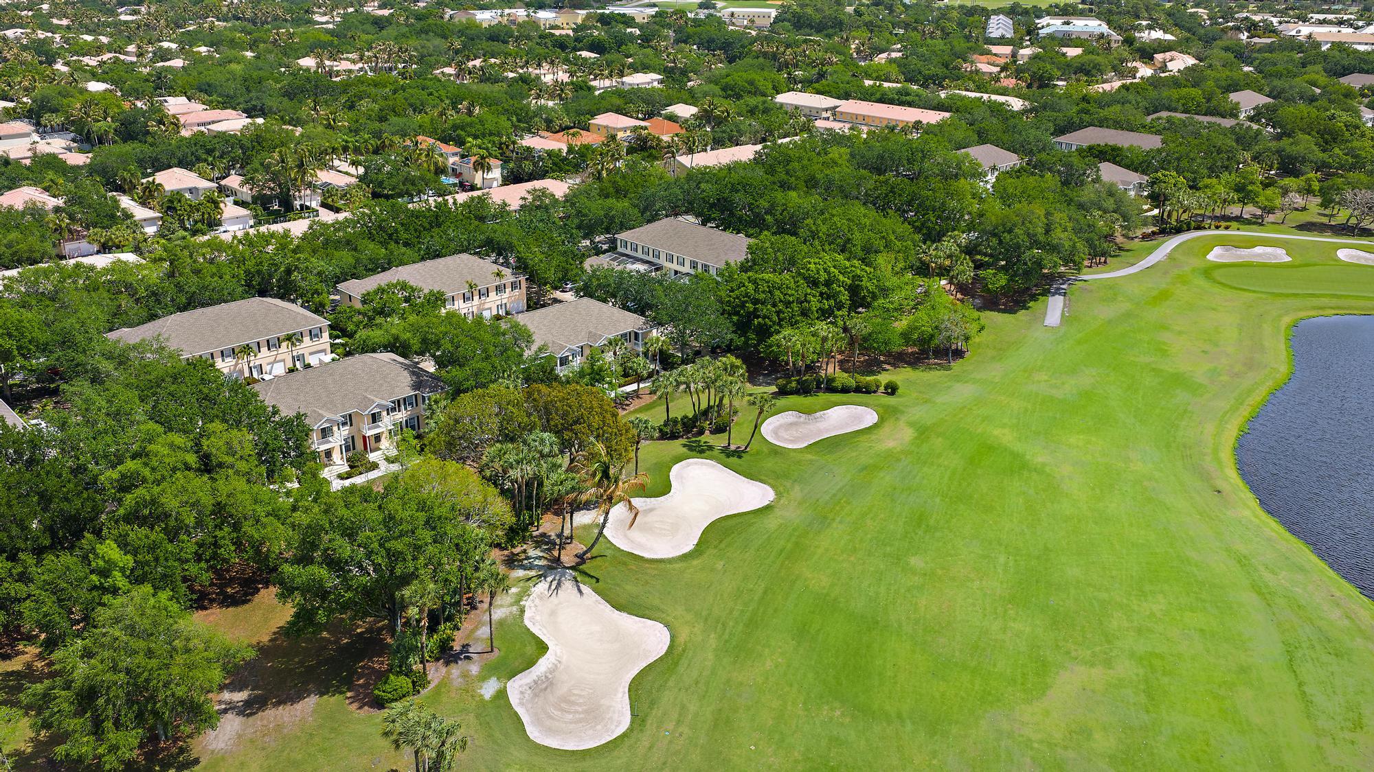 136 Ashley Court Jupiter, FL 33458 - Photo 25 of 26 a view of a bunch of trees and houses