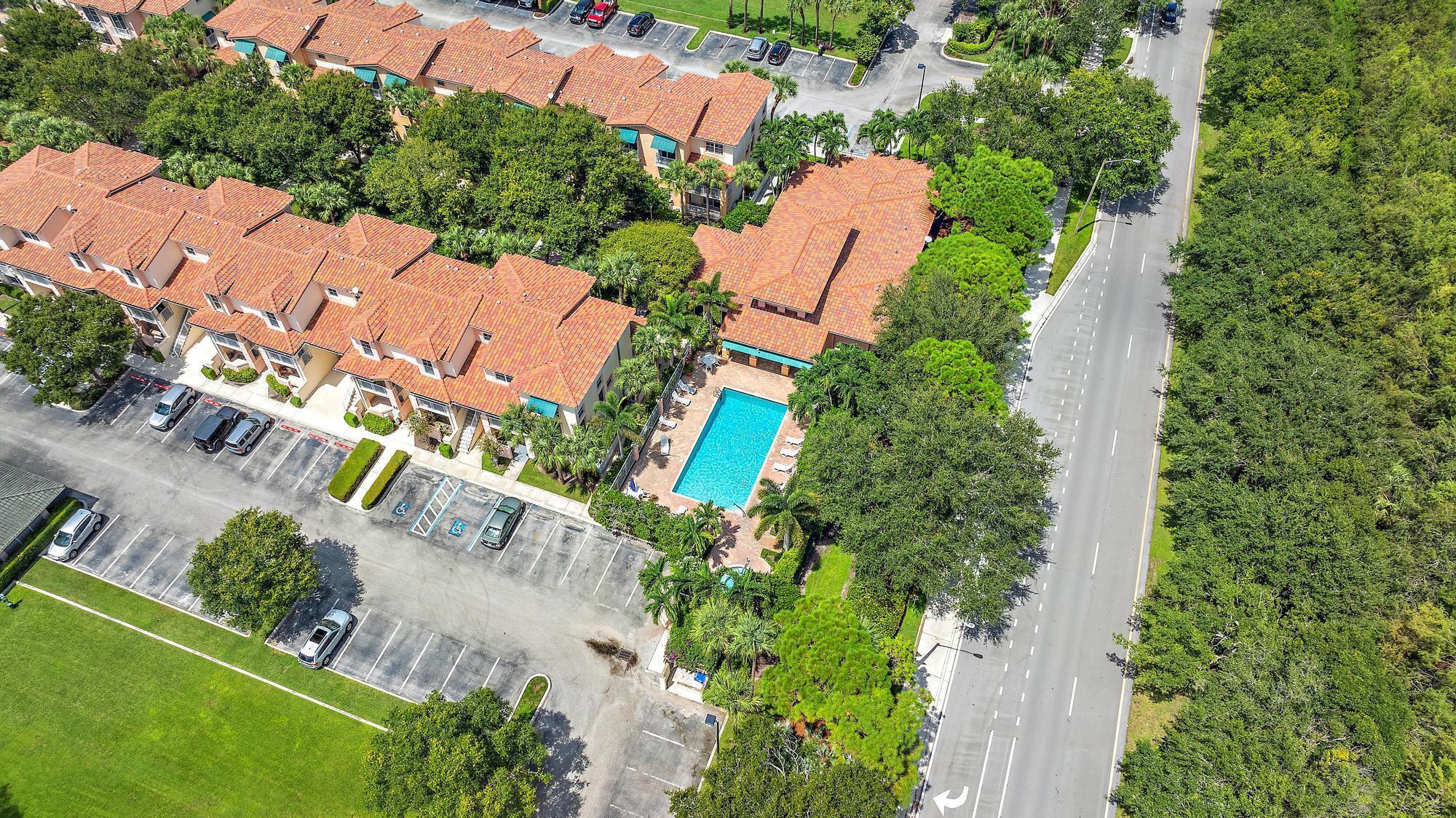 136 Ashley Court Jupiter, FL 33458 - Photo 26 of 26 an aerial view of residential house with outdoor space and swimming pool