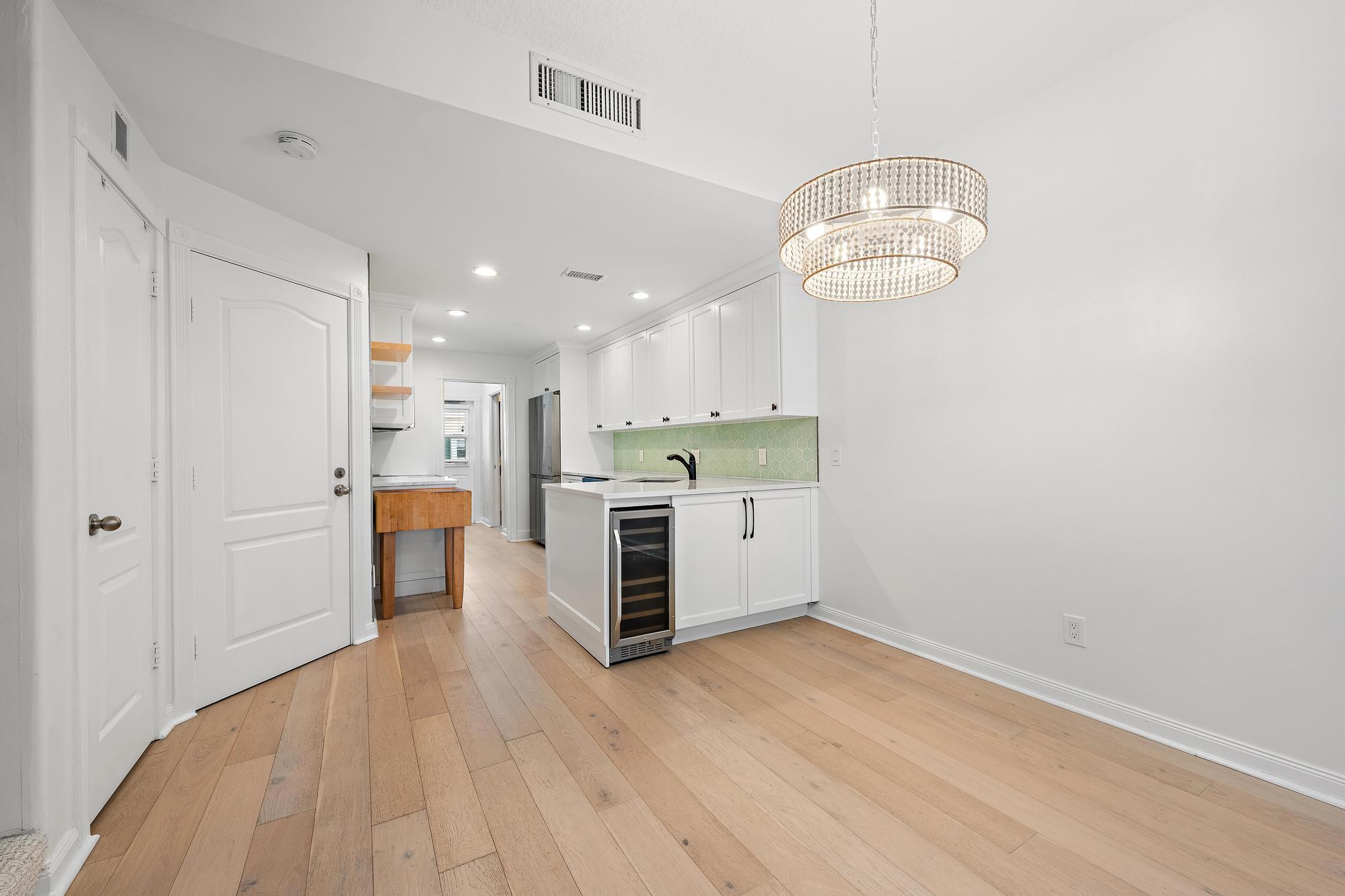 136 Ashley Court Jupiter, FL 33458 - Photo 6 of 26 a view of a kitchen with stainless steel appliances a wooden floor