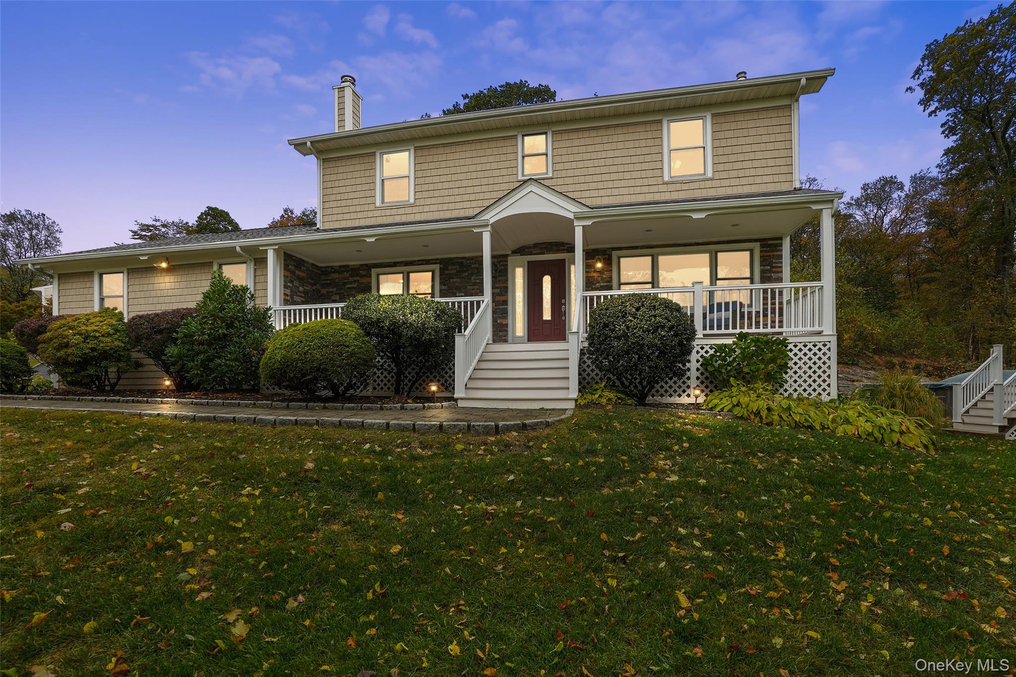 4 Wayacross Road Mahopac, NY 10541 - Photo 1 of 1 View of front facade with a porch, a front yard, and stairway