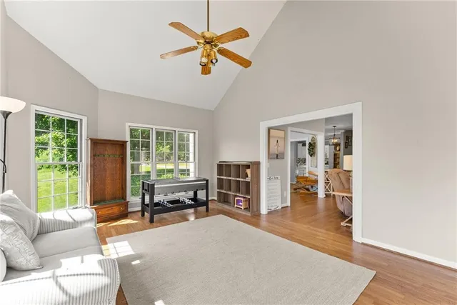 a view of a livingroom with furniture and a flat screen tv