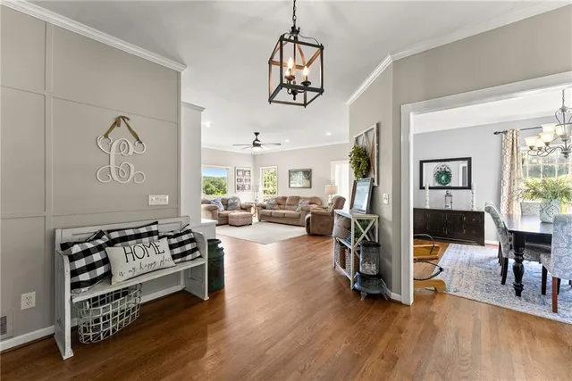 a dining room with furniture and a window