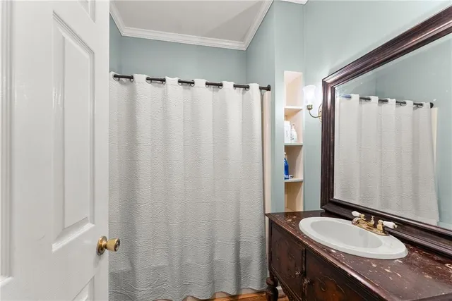a view of a kitchen with fridge and wooden floor