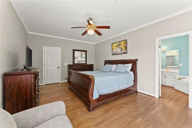 a bedroom with a bed and a couch