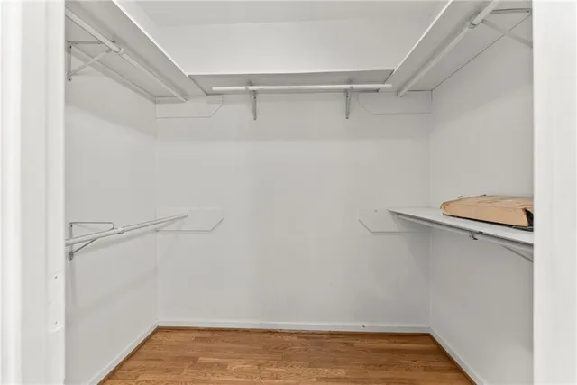 a living room filled with furniture and a chandelier