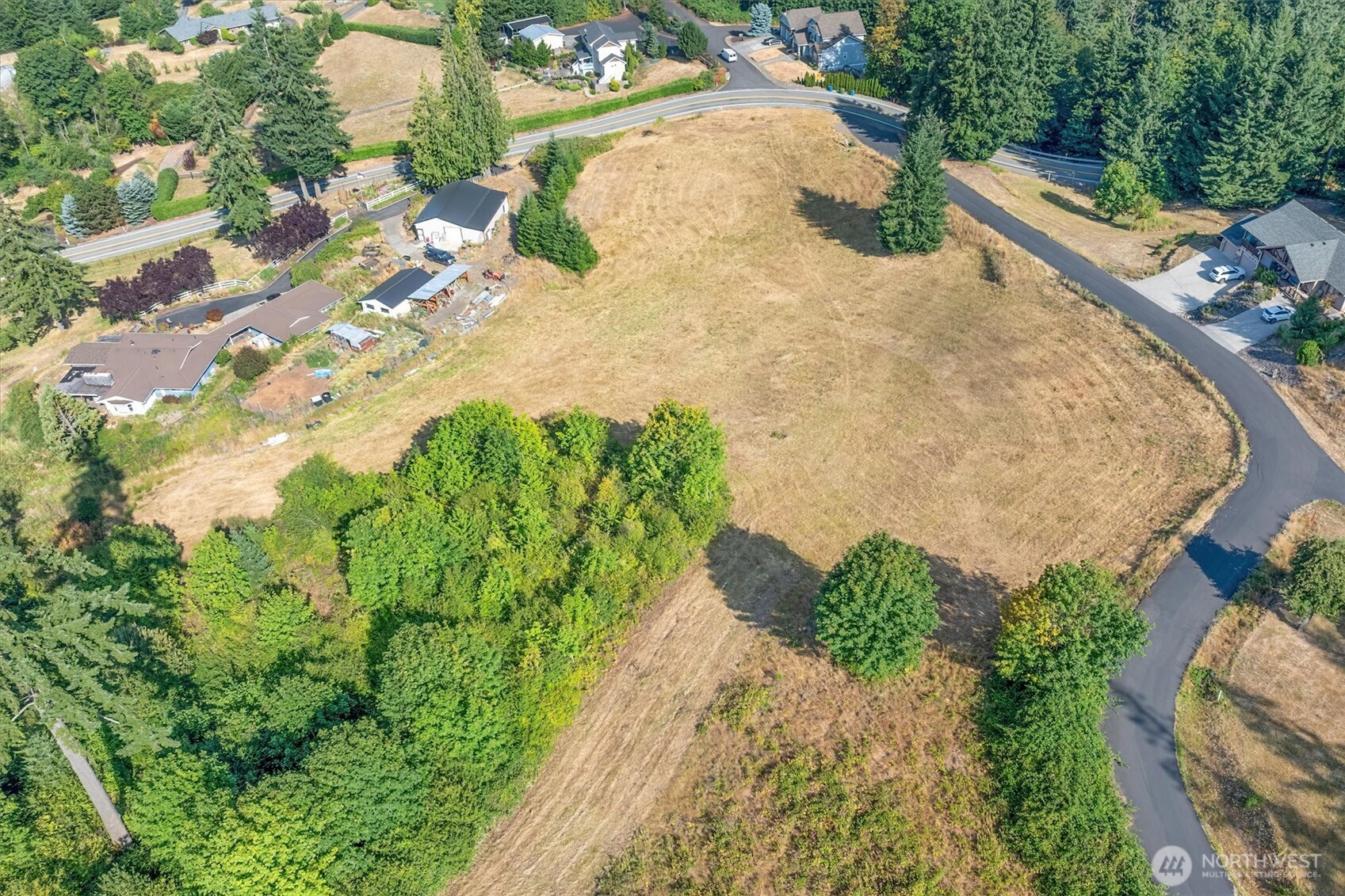 110 Jade Road Woodland, WA 98674 - Photo 22 of 32 an aerial view of a house with a yard and trees