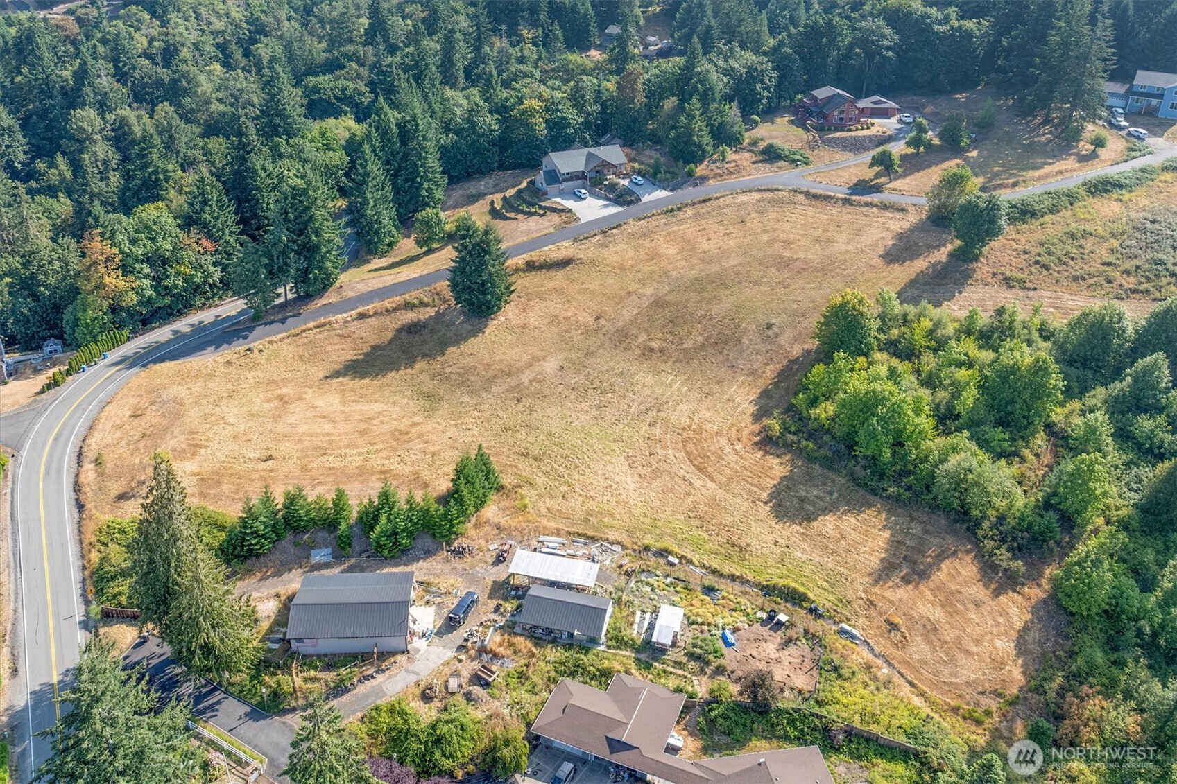 110 Jade Road Woodland, WA 98674 - Photo 26 of 32 an aerial view of a house with a yard and greenery