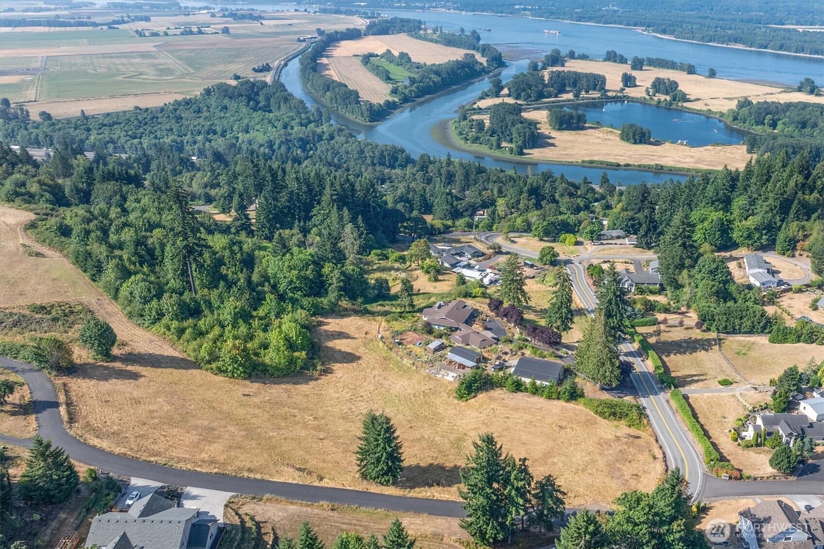 110 Jade Road Woodland, WA 98674 - Photo 4 of 32 an aerial view of a house with a yard and lake view