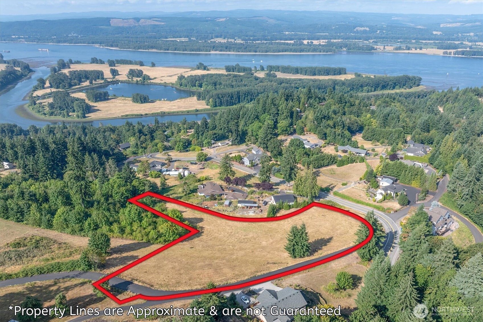 110 Jade Road Woodland, WA 98674 - Photo 5 of 32 an aerial view of a house with a garden and lake view