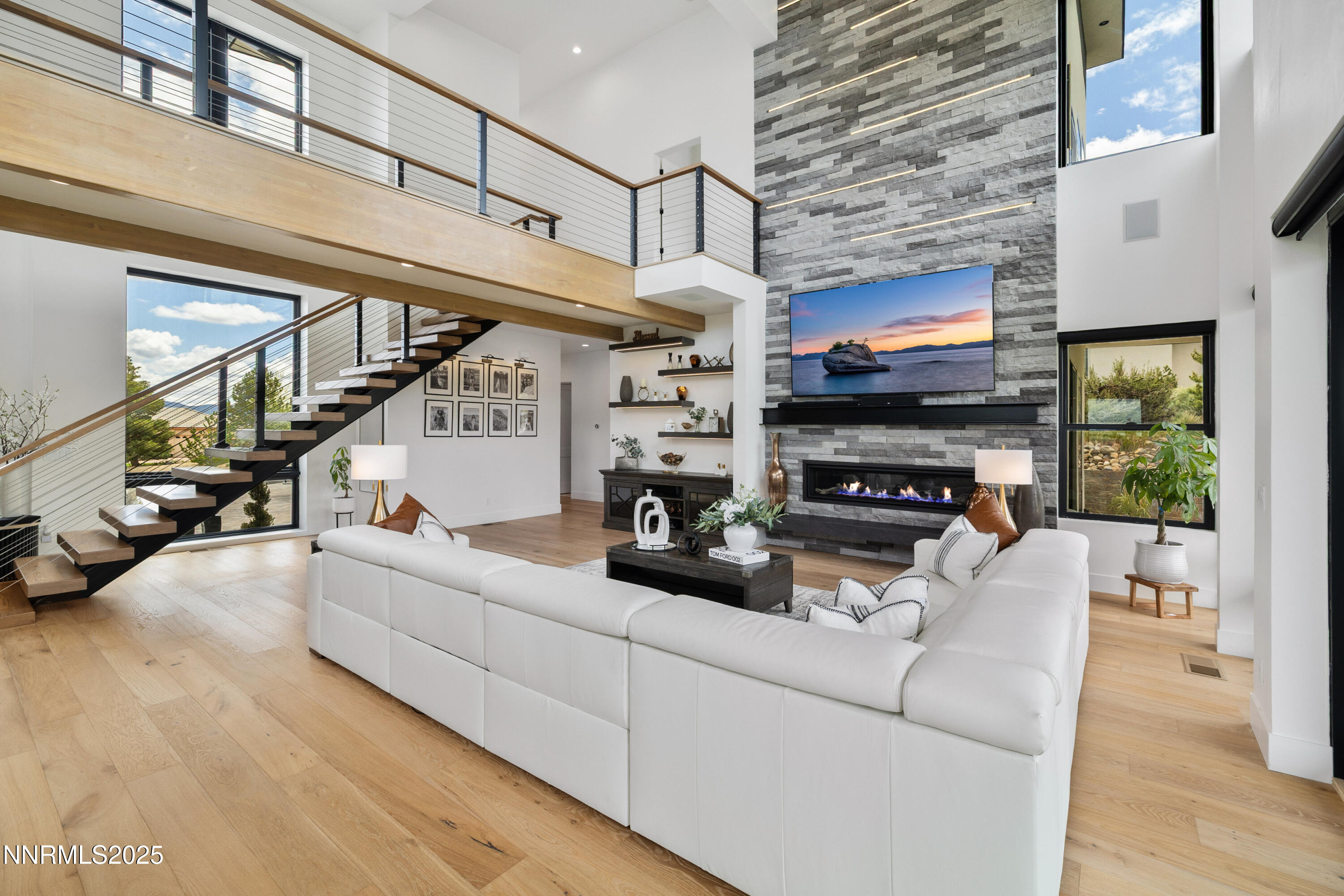 3041 Palmer Pointe Court Reno, NV 89511 - Photo 11 of 40 a living room with furniture a flat screen tv and a fireplace