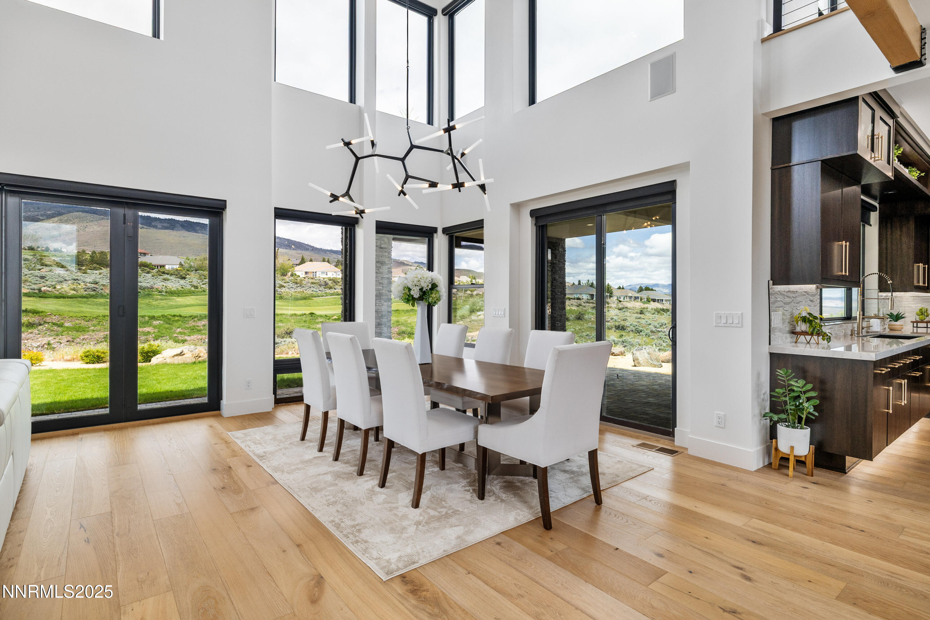 3041 Palmer Pointe Court Reno, NV 89511 - Photo 14 of 40 a view of a dining room with furniture window and wooden floor