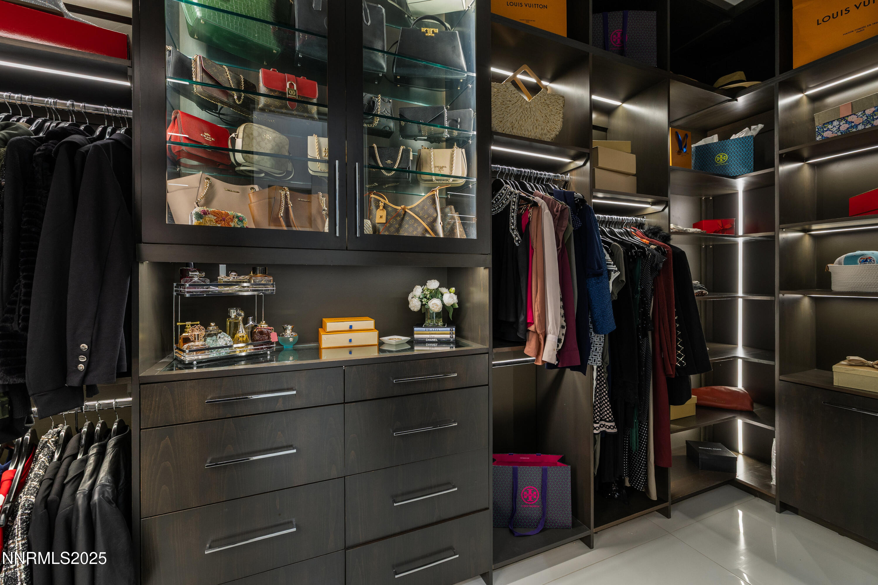 3041 Palmer Pointe Court Reno, NV 89511 - Photo 22 of 40 a view of walk in closet with clothes and shoes