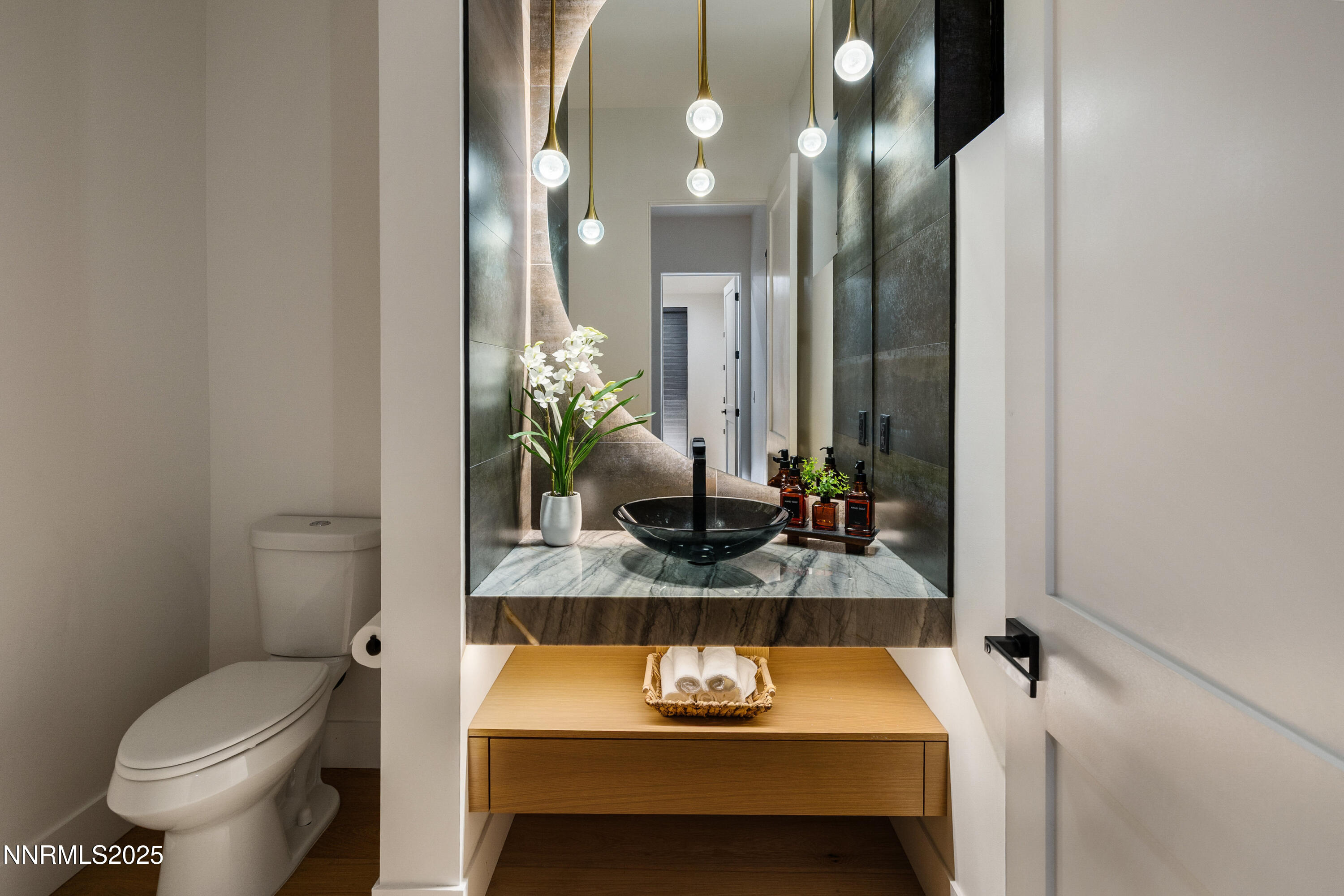 3041 Palmer Pointe Court Reno, NV 89511 - Photo 28 of 40 a bathroom with a granite countertop sink and a mirror