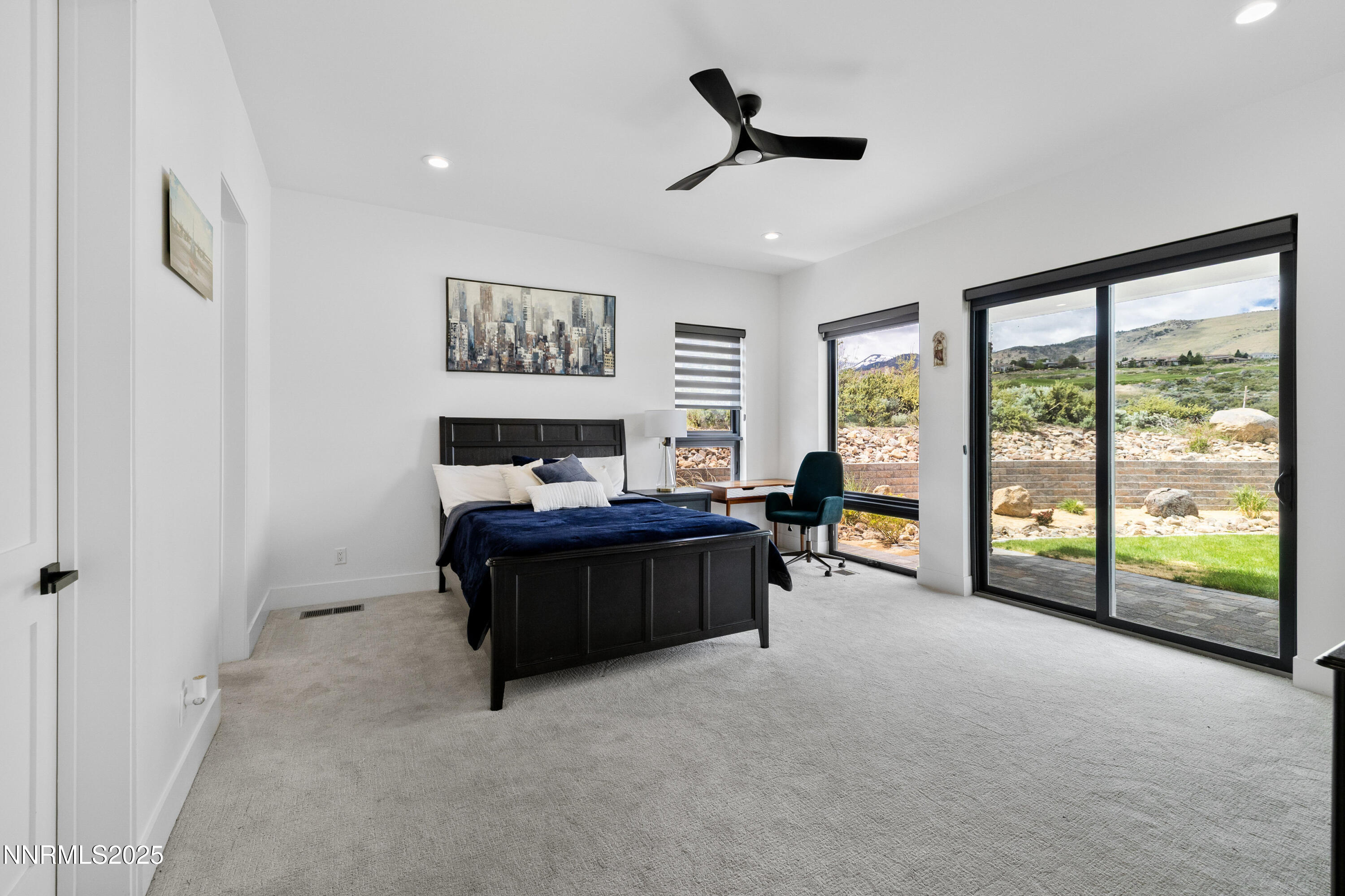 3041 Palmer Pointe Court Reno, NV 89511 - Photo 29 of 40 a living room with furniture and a floor to ceiling window