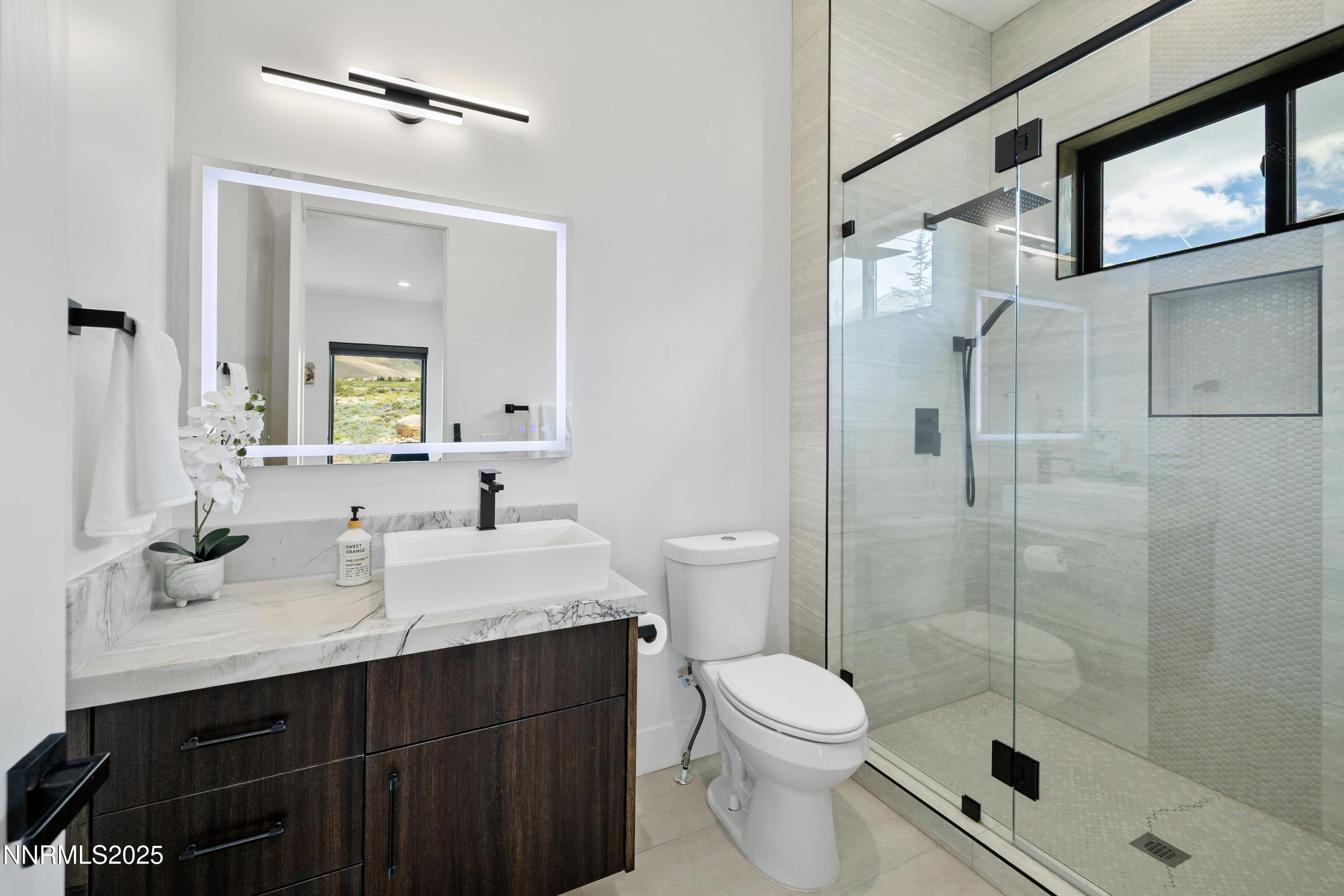 3041 Palmer Pointe Court Reno, NV 89511 - Photo 30 of 40 a bathroom with a sink a toilet and shower
