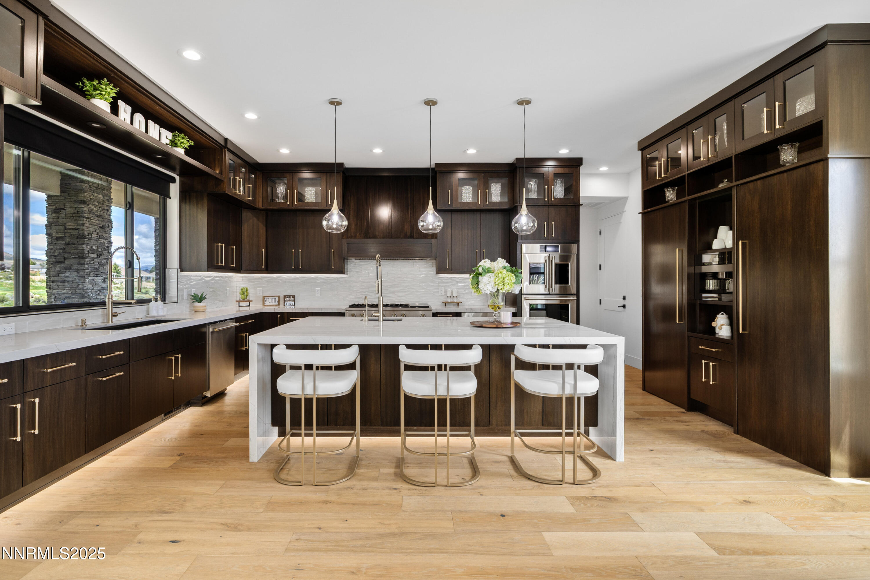 3041 Palmer Pointe Court Reno, NV 89511 - Photo 6 of 40 a kitchen with a sink cabinets and wooden floor