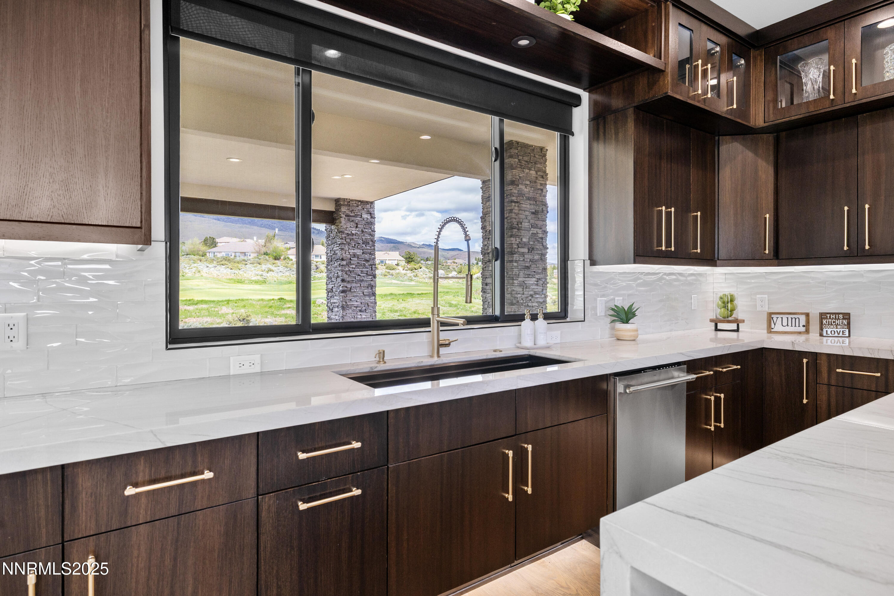 3041 Palmer Pointe Court Reno, NV 89511 - Photo 8 of 40 a kitchen with a sink stove and cabinets