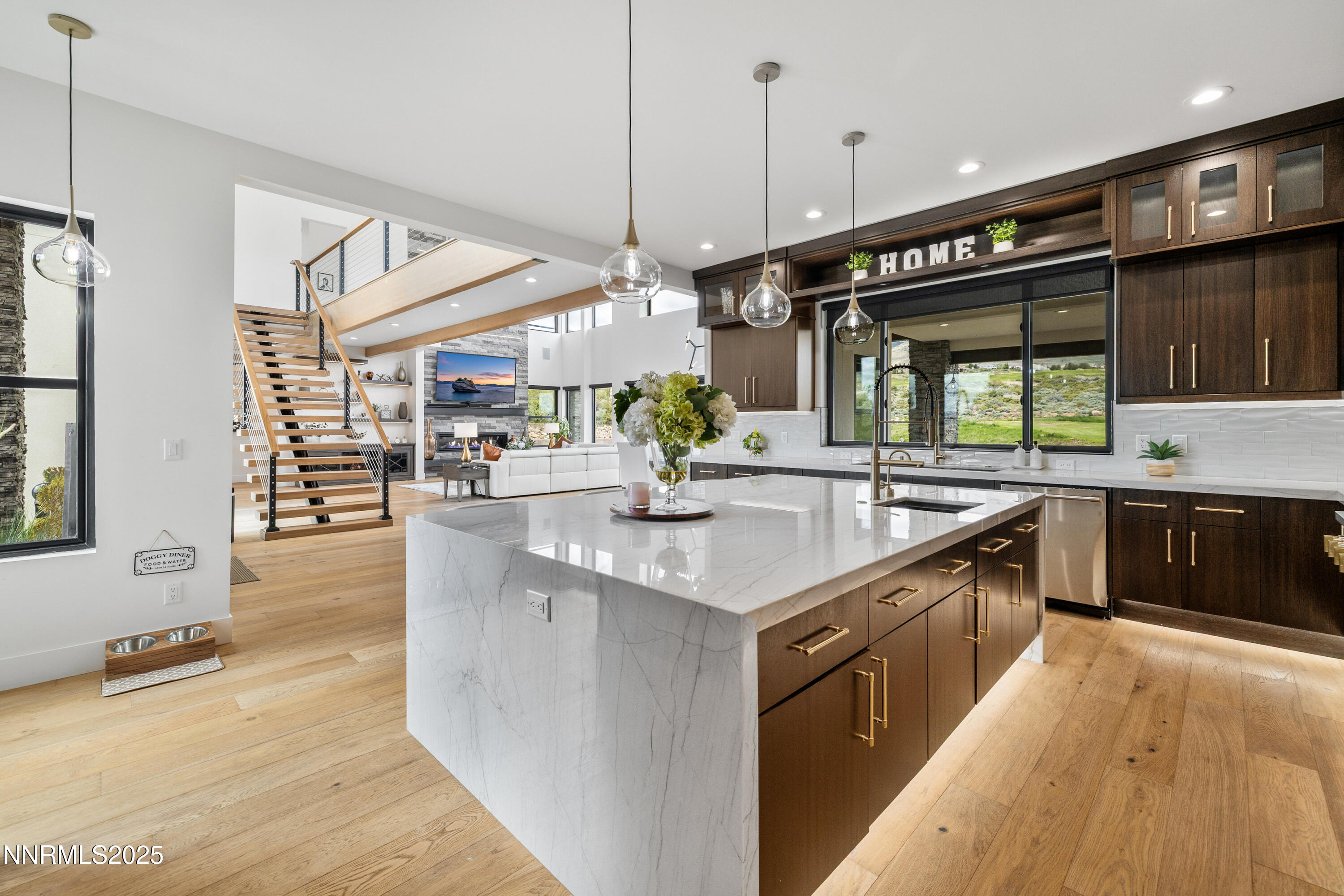 3041 Palmer Pointe Court Reno, NV 89511 - Photo 9 of 40 a kitchen with stainless steel appliances granite countertop a sink a stove and a wooden floors