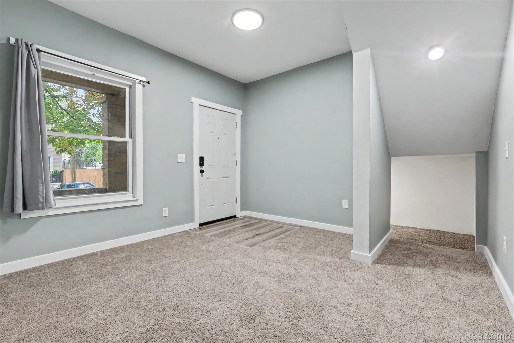 8397 Lane Street Detroit, MI 48209 - Photo 3 of 41 Entry area featuring recessed lighting, wood-finish flooring at the entryway, and a window with white trim