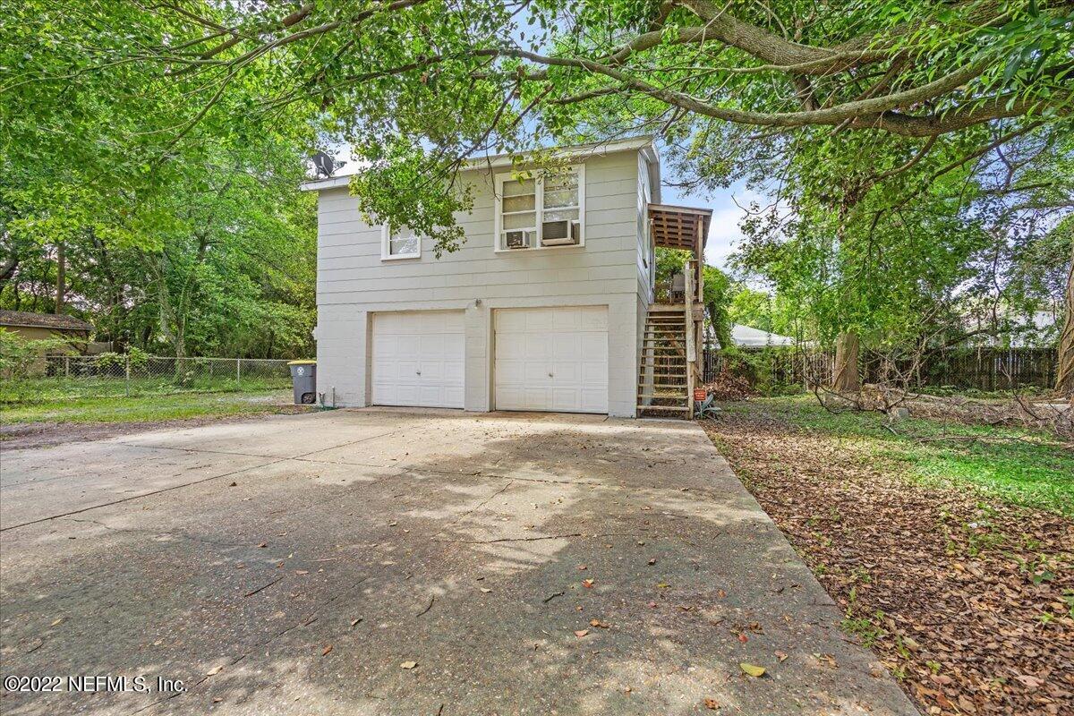 352 West 68th Street Jacksonville, FL 32208 - Photo 11 of 11 a front view of a house with a yard and garage