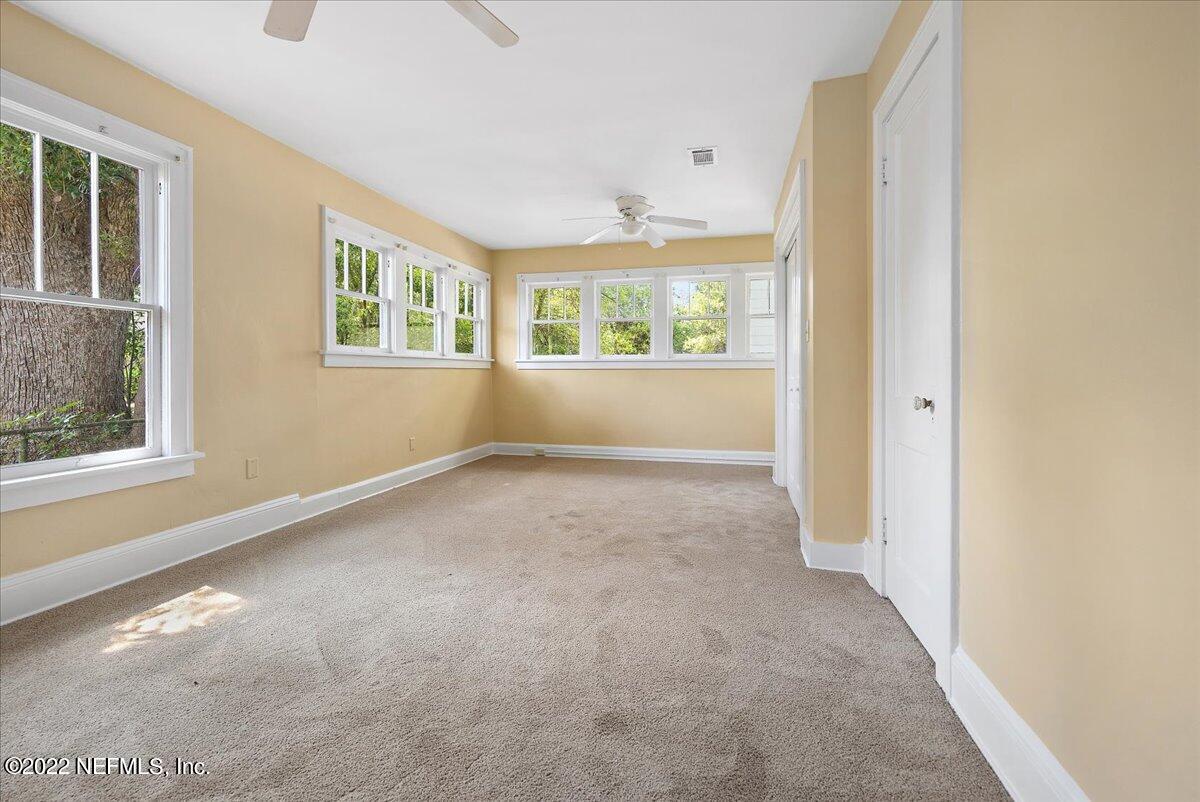 352 West 68th Street Jacksonville, FL 32208 - Photo 8 of 11 an empty room with windows