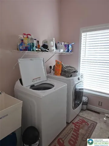 a utility room with dryer and washer