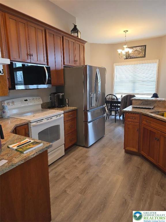 1206 Shiloh Road Lower Macungie Township, PA 18106 - Photo 3 of 14 a kitchen with stainless steel appliances a sink a stove a refrigerator cabinets and a dining table