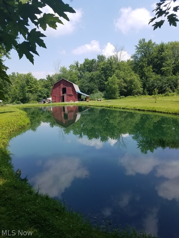 5980 Barrett Road Geneva, OH 44041 - Photo 4 of 22 Gambrel barn with fully stocked pond equipped with two areators.