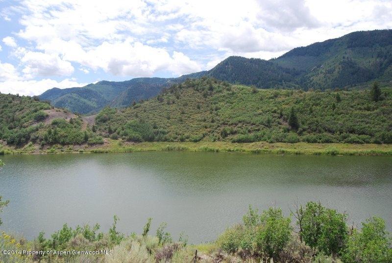 an aerial view of mountain with lake view