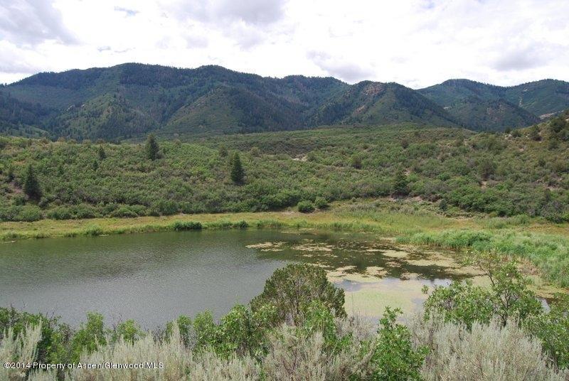 8175 County Road 252 Rifle, CO 81650 - Photo 2 of 39 a view of lake with mountain