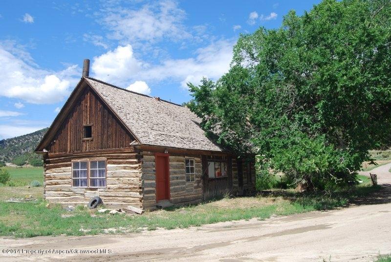 8175 County Road 252 Rifle, CO 81650 - Photo 22 of 39 a front view of a house with a garden