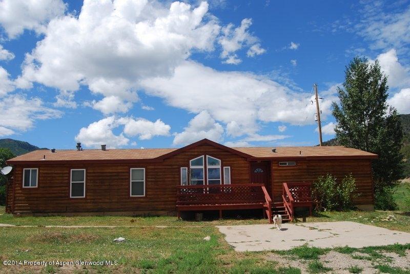 8175 County Road 252 Rifle, CO 81650 - Photo 24 of 39 a backyard of a house with table and chairs