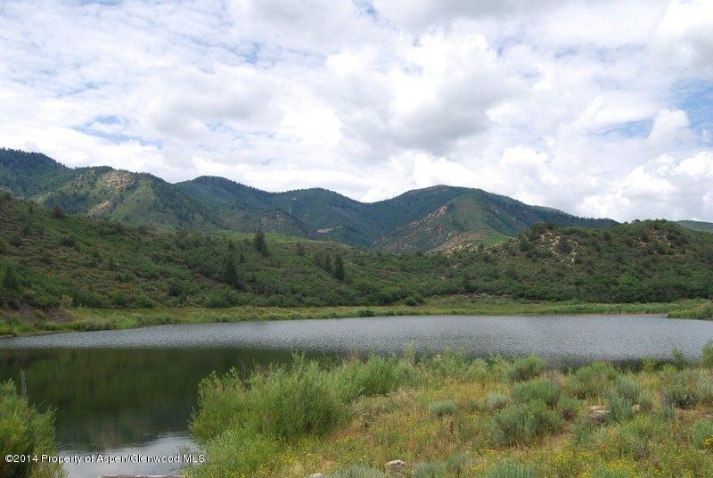 8175 County Road 252 Rifle, CO 81650 - Photo 4 of 39 a view of a lake with a mountain in the background
