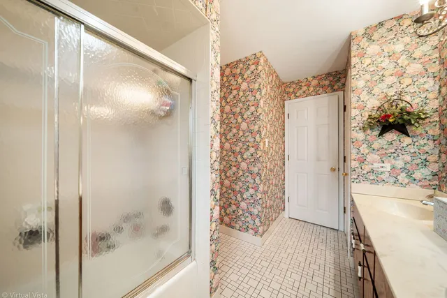 a bathroom with a bathtub and shower