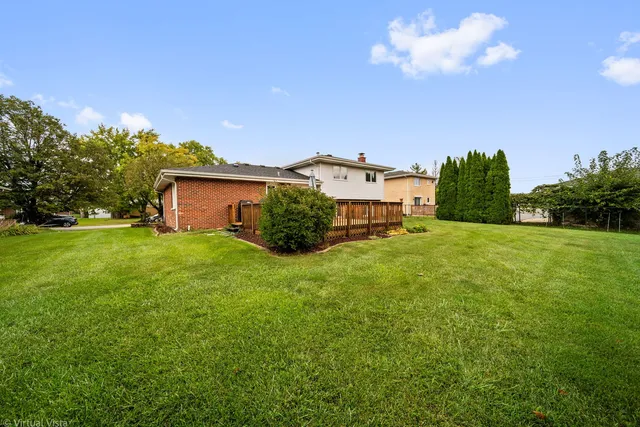 an aerial view of a house with a garden
