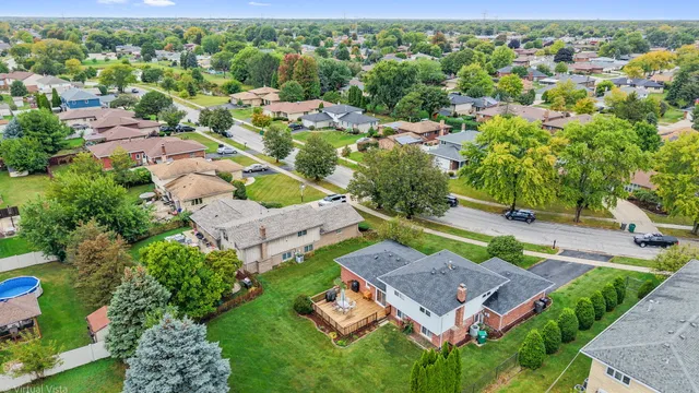 an aerial view of a house with a garden and plants